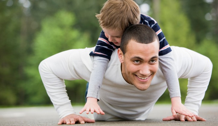 Boy Laying on Man Doing Pushups Boy Laying on Man Doing Pushups
