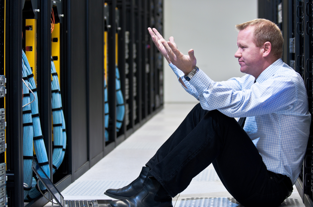 Frustrated Man in Data Center Frustrated Man in Data Center