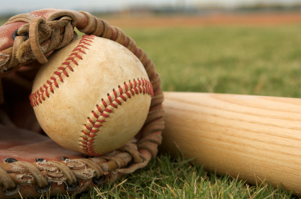 Baseball in a Glove near Bat