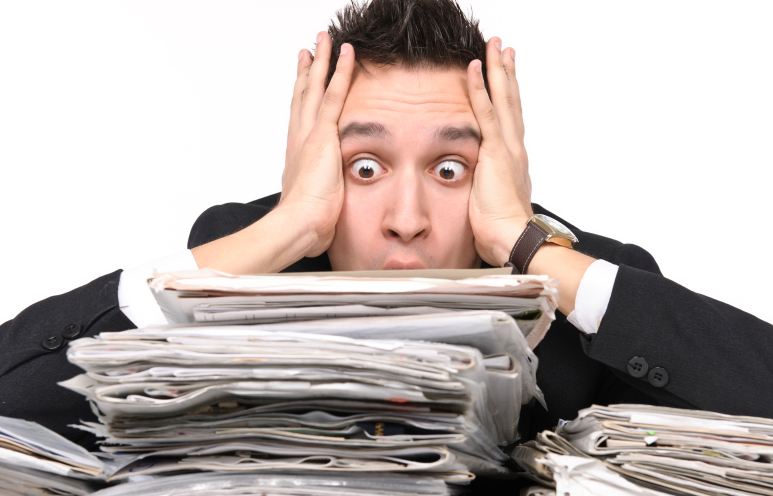 Business owner overwhelmed by paperwork