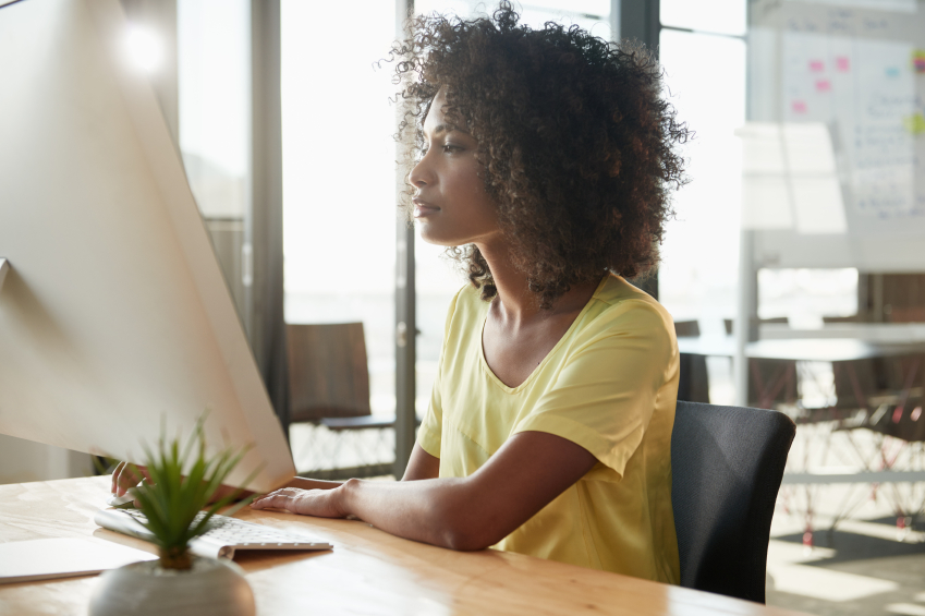 Shot of an attractive young businesswoman working on her office computer