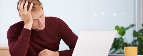 A handsome businessman working at his desk