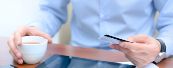 Man using a credit card for online shopping