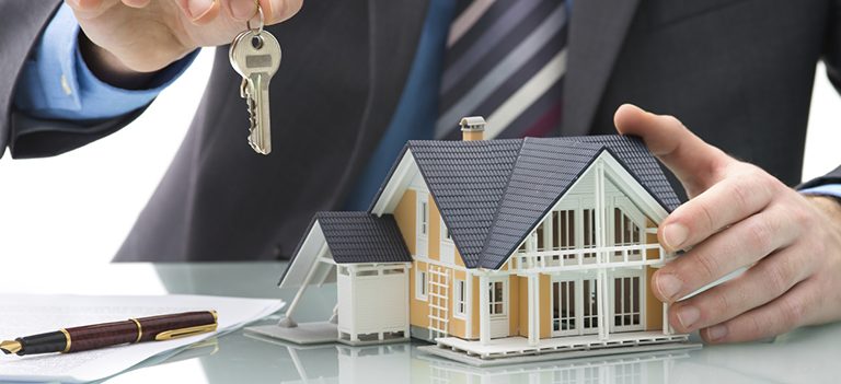 Man signs purchase agreement for a house