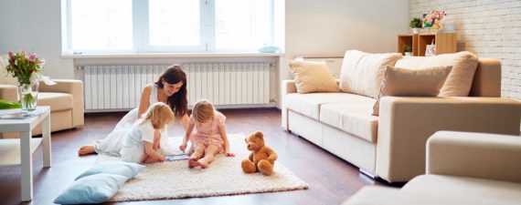Mother playing with daughter at home