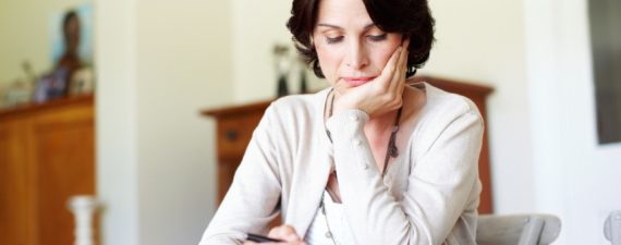 A mature woman busy budgeting