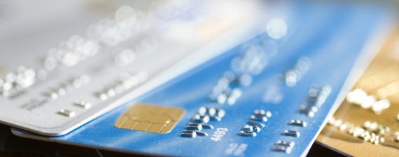 Pile of credit cards, narrow focus.