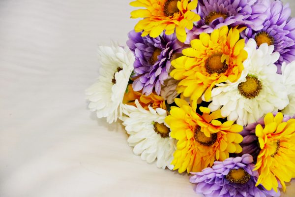 Instead of a fresh flowers, Brittany bought silk daisies from Michaels and arranged them. The total cost for the bouquet was $9.