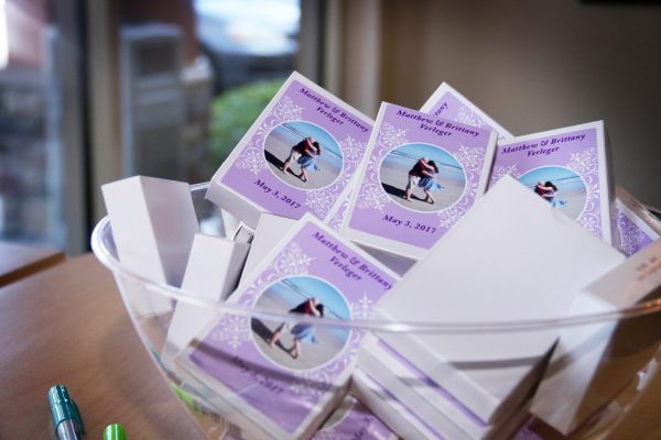 The couple gave playing cards featuring their engagement photos as wedding favors.