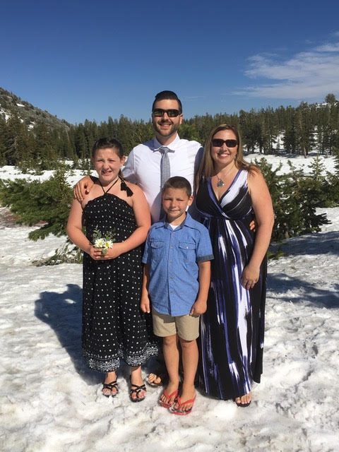 The Bryants pose in flip-flops in the snow after a vow renewal ceremony moved from the beach to the mountain to escape crowds.